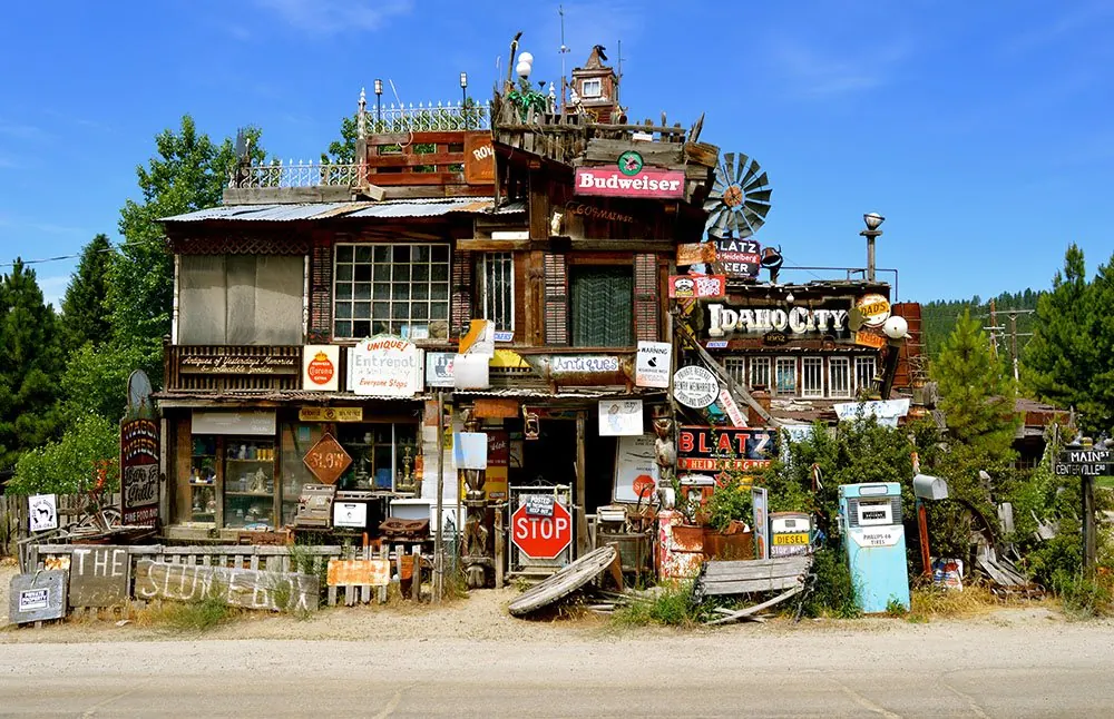 Historic storefront covered in vintage signs in Idaho City