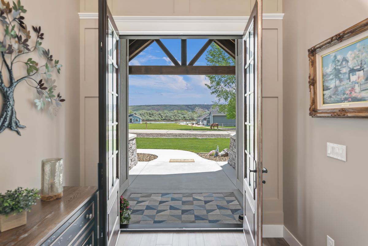 Open front door framing a view of the Idaho landscape